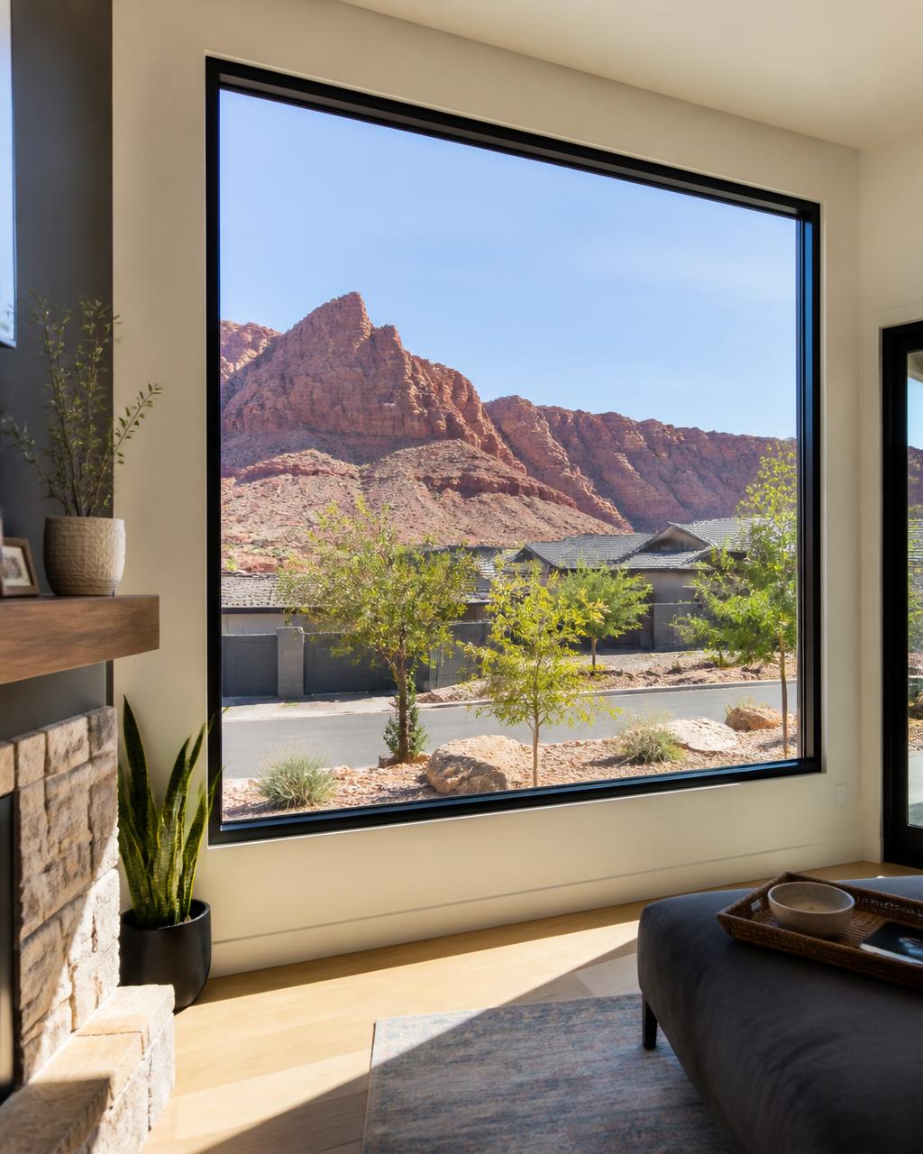 Large black-framed picture window installed in a bright Southern Utah home